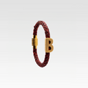 MAGNET CUERO TRENZADO B ORO