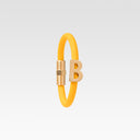 B gold and rubber bracelet